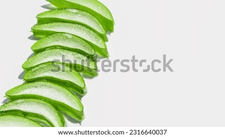 Slides, pieces of green fresh aloe vera. On a white background. 
