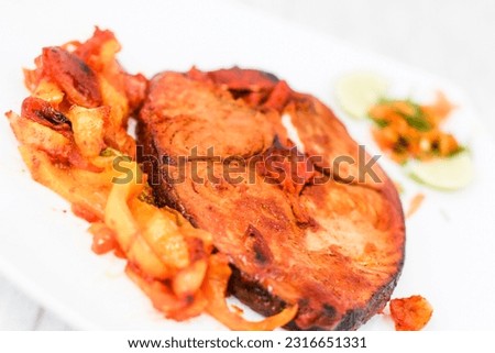 Salmon Fish Steak grilled on white plate ,close-up 
