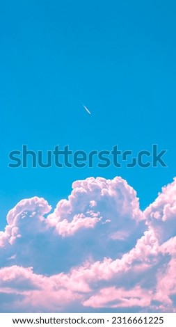 White ,pink and transparent clouds on the blue sky.for post background text area