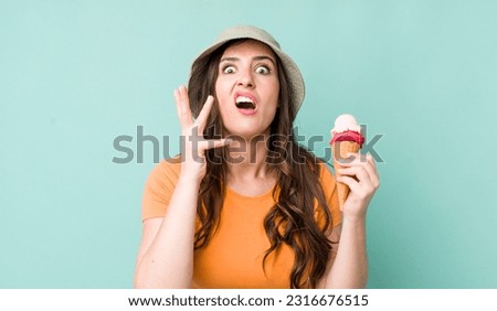 young pretty woman  looking desperate, frustrated and stressed. summer and ice cream concept Royalty-Free Stock Photo #2316676515
