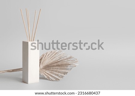 Reed diffuser on grey background