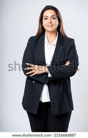 Indian businesswoman or employee standing on white background. Royalty-Free Stock Photo #2316686887