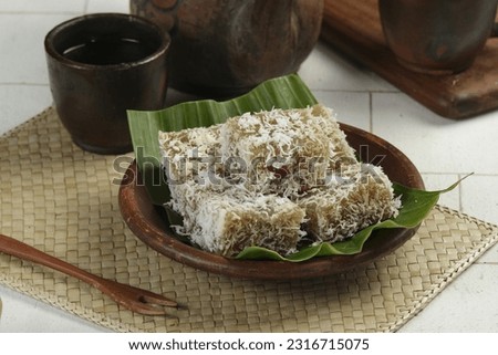 Ongol Ongol, Indonesian Traditional Snacks, made from Arrowroot Flour and Brown Sugar, Coated with Grated Coconut