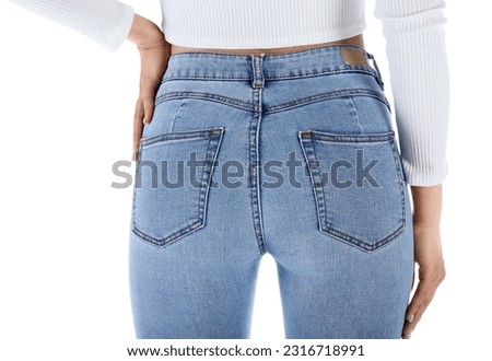 Young woman in skinny jeans on white background, back view Royalty-Free Stock Photo #2316718991