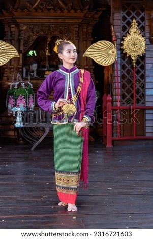 Thai woman dressed in traditional Northern Thailand culture costume. Identity culture of Thailand