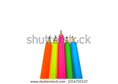 Pencils. Various colors. Lined up. On a white background. Isolated. Top view photo