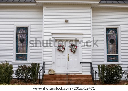 An outdoor white church building in the countryside of Broadway North Carolina 