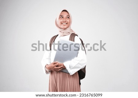 Young muslimah female student is carrying books. Prepare back to school isolated white background