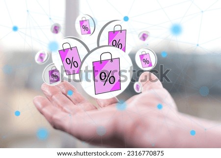 Sale concept above a hand of a man