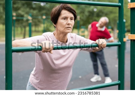 elderly couple trains together on a sports Royalty-Free Stock Photo #2316785381