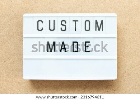Lightbox with word custom made on wood background