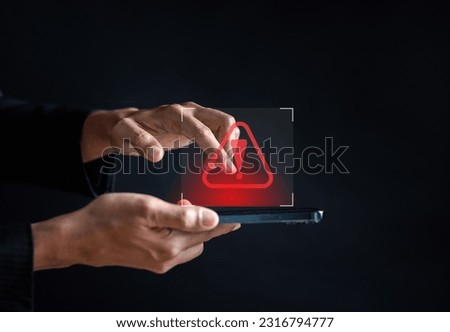 Scammer alert and warning caution signs on mobile phone. cyber attack on online network error system. Cybersecurity vulnerability, data breach, illegal connection, compromised information. Royalty-Free Stock Photo #2316794777