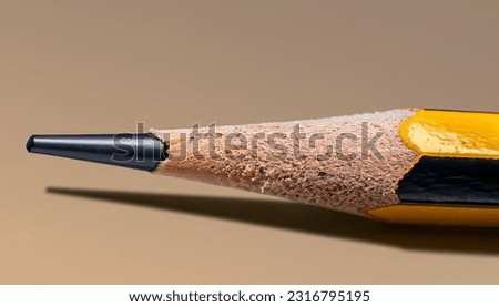 Close up and isolated sharpened pencil with clean and white background