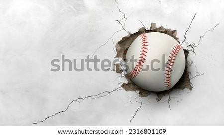 A baseball hits through a cement wall. concept of strength Royalty-Free Stock Photo #2316801109