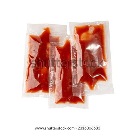 Ketchup in Square Plastic Bag Isolated, One-Time Portion Transparent Catsup Sachet, Hot Tomato Sauce, Red Dressing, Ketchup Portion on White Background, Clipping Path Royalty-Free Stock Photo #2316806683