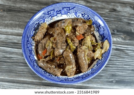 Middle Eastern cooked beef sausage, Egyptian sausages with green peppers, onion, garlic, tomato, black pepper and oil, it is a dry, spiced sausage either beef or lamb consumed in Middle East
