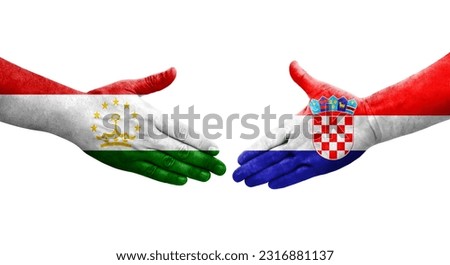 Handshake between Tajikistan and Croatia flags painted on hands, isolated transparent image.