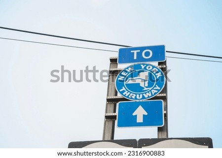 A view of a sign to the Thruway Royalty-Free Stock Photo #2316900883