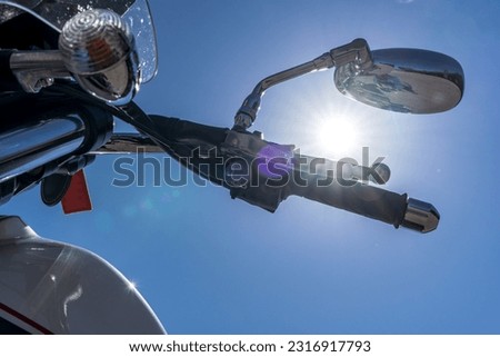Motorcycle on a blue sky background. Front part of classic motorcycle