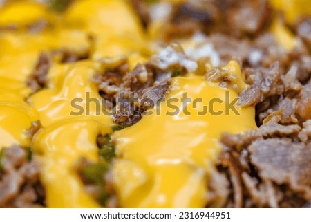 Meat baked and filled with melted cheese, selective focus 
