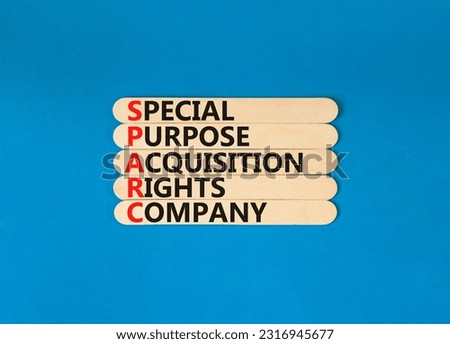 SPARC special purpose acquisition company symbol. Concept words SPARC special purpose acquisition company on wooden stick. Blue background. Business SPARC special purpose acquisition company concept