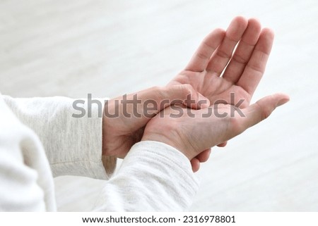 Woman suffering from numb hands