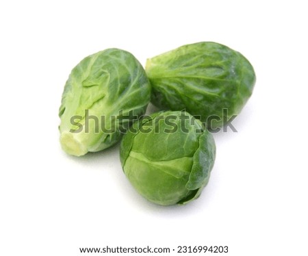 Apile of Brussels sprouts on a white background Royalty-Free Stock Photo #2316994203