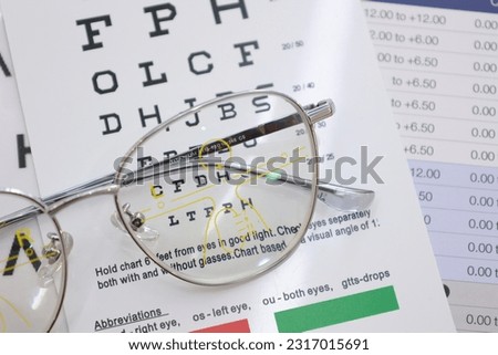 Eyeglass on the chart, eyeglass progressive lenses, eyeglasses for the elderly, half glasses on chart, eyeglasses progressive lens Royalty-Free Stock Photo #2317015691
