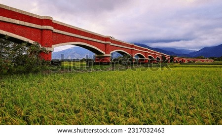 The bridge  is a vast and spectacular agricultural irrigation waterway in the rice field, Ercengping,Taiwan.for branding,calender,postcard,screensave,poster,banner,cover,website.High quality photo