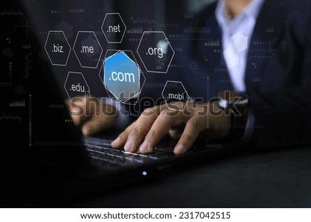 Businessman using laptop to choosen sub domain name dot com or .com to registeration the commercial website. Royalty-Free Stock Photo #2317042515