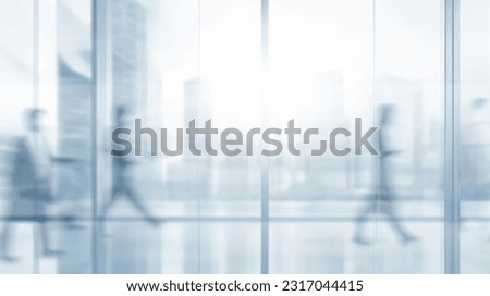 motion blur of people walking on  glass window wall building background office blur abstract background from building hallway 