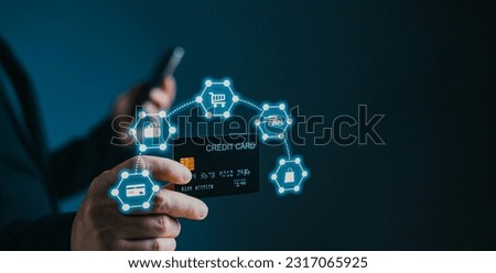 businessman showing a mock-up credit card for business and shopping to make payment and smartphone.half body. purchase, commerce, financial, card, money, using technology. selective focus.