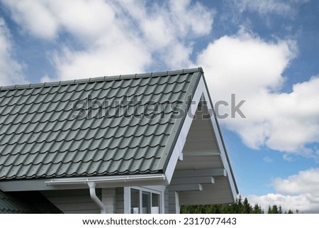 Metal tile.Roof for the house. Modern coatings for the roof of the house. Royalty-Free Stock Photo #2317077443