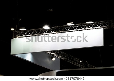 Hanging white indoor billboard with spot light