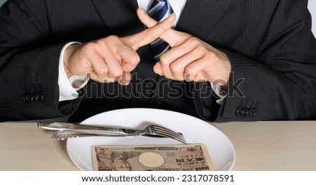 An image of a businessman who refuses to eat an extravagant meal.
Translation: Bank of Japan, 10000, Bank of Japan, National Printing Bureau, Yukichi Fukuzawa.