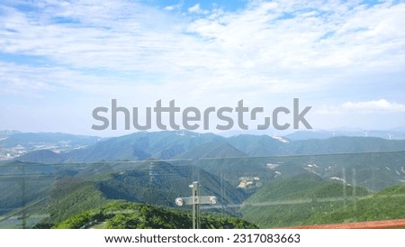 the topography and view of a mountain from a high mountain
an uncorrected photograph
a clear sky, beautiful nature