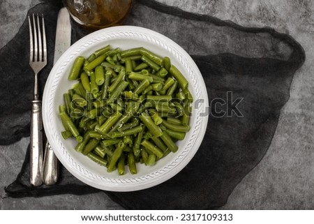 boiled healthy fresh green beans in white small bowl Royalty-Free Stock Photo #2317109313