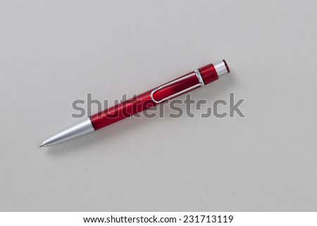 Red Pen isolated on Grey Background with Real Shadow and Texture. Top View with Copy Space for Text or image