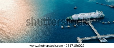 LNG (Liquified Natural Gas) tanker anchored in Gas terminal gas tanks for storage. Oil Crude Gas Tanker Ship. LPG at Tanker Bay Petroleum Chemical or Methane freighter export import transportation  Royalty-Free Stock Photo #2317156023