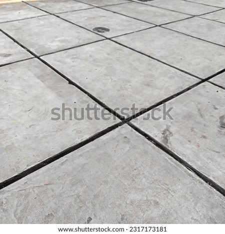 Photo of garage floor with grout in full size
