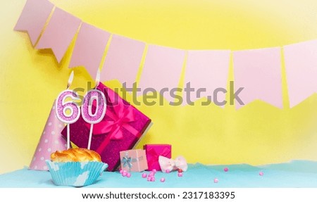 Date of birth with cake and number  60. Colorful card happy birthday for a girl. Copy space. Anniversary card pink. Congratulations on the decorations are beautiful.
