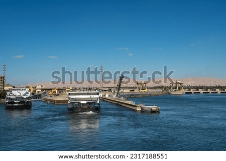Cruises passing through the Esna Lock, a structure of water gateway on the river Nile that links Luxor and Aswan, Esna, Egypt