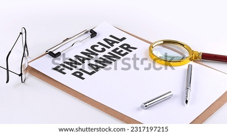 FINANCIAL PLANNER text on a clipboard on white background, business concept