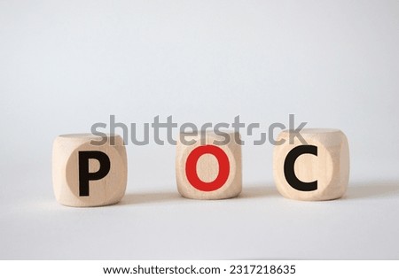 POC - Proof of Concept symbol. Wooden cubes with words POC. Beautiful white background. Business and POC concept. Copy space.