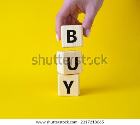 BPM - Business Process Management symbol. Wooden cubes with words BPM. Businessman hand. Beautiful yellow background. Business and BPM concept. Copy space.