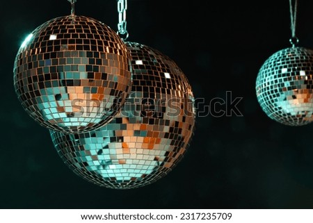 Shiny bright disco balls on dark background