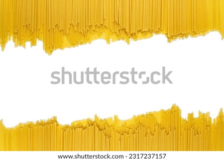 Raw spaghetti on a white isolated background. Background of dry uncooked spaghetti with free space for text in the center. Empty space for design idea. Culinary concept for a restaurant
