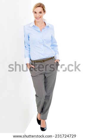 Young businesswoman with white board for copyspace relaxed and confident