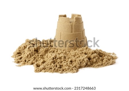 Pile of sand with beautiful castle isolated on white. Outdoor play
