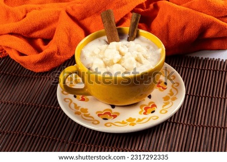 cup of canjica, typical food consumed in the Brazilian Festa Juninas (june Party) Royalty-Free Stock Photo #2317292335